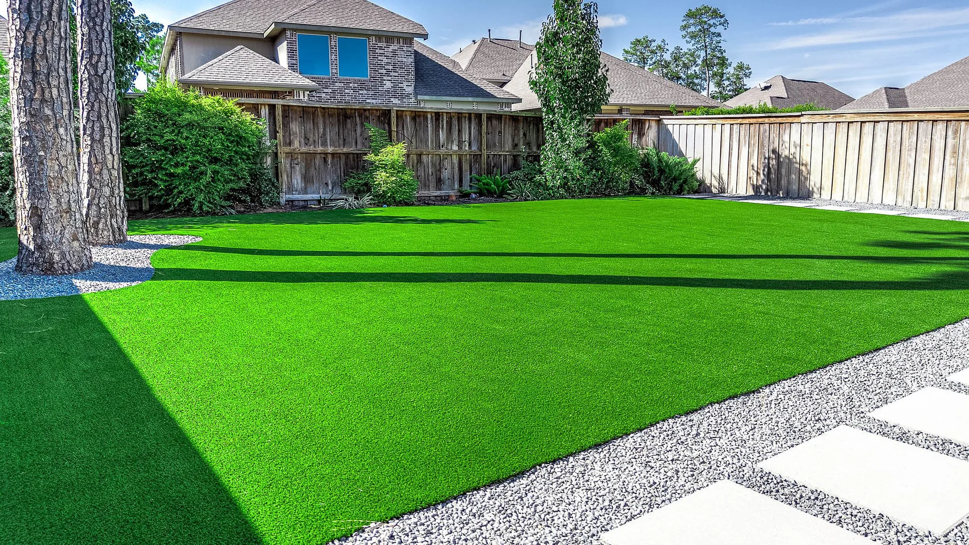Lush artificial turf backyard lawn